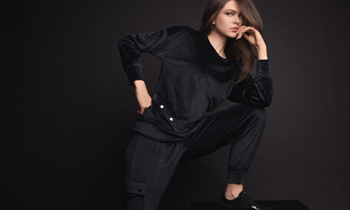 Black Leisure soft velour crew-neck tracksuit styled as an evening outfit